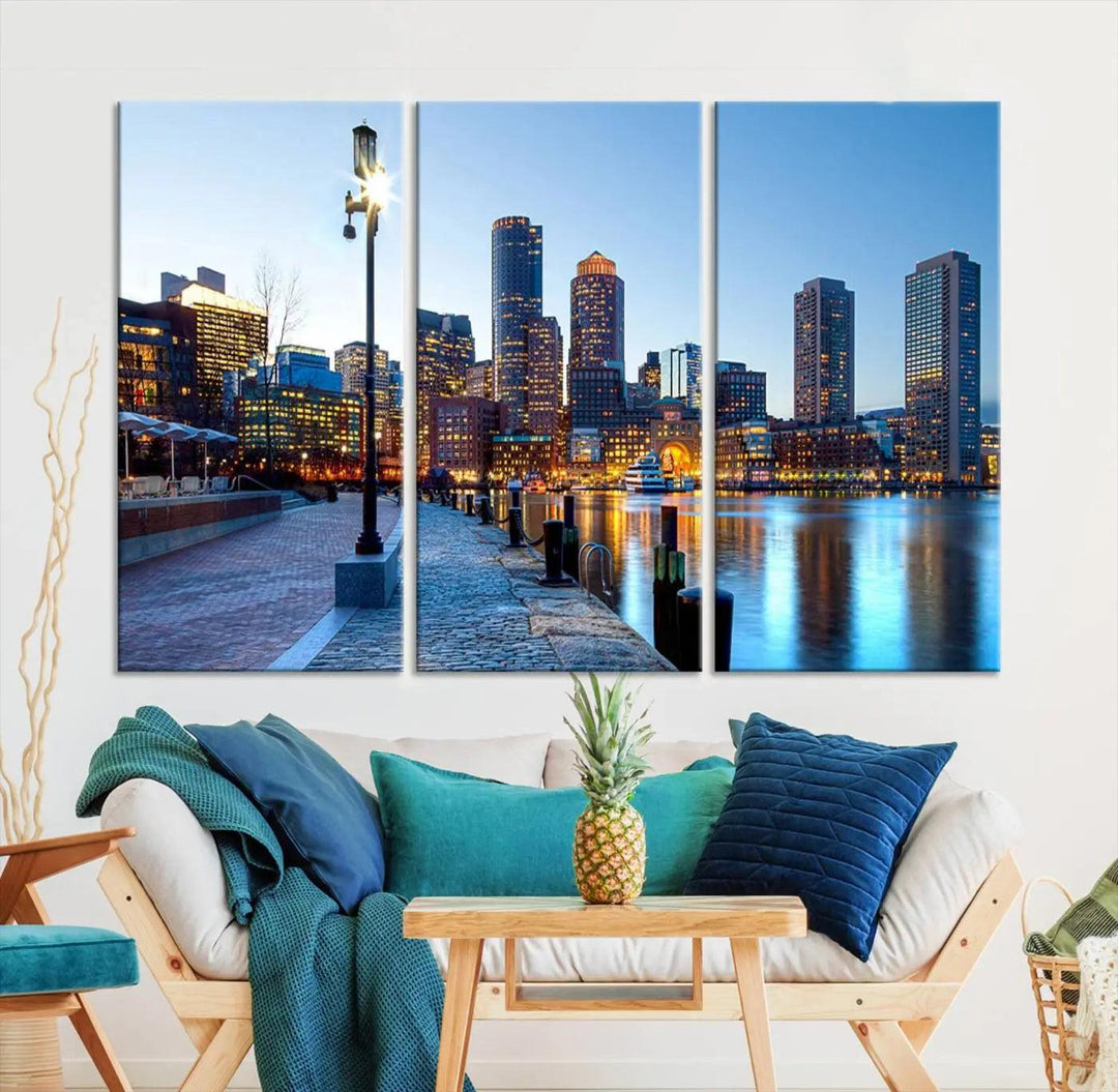 The modern living room features the Boston City Lights Sunrise Skyline Cityscape View Wall Art Canvas Print, crafted with museum-quality canvas and a UV-protective coating.