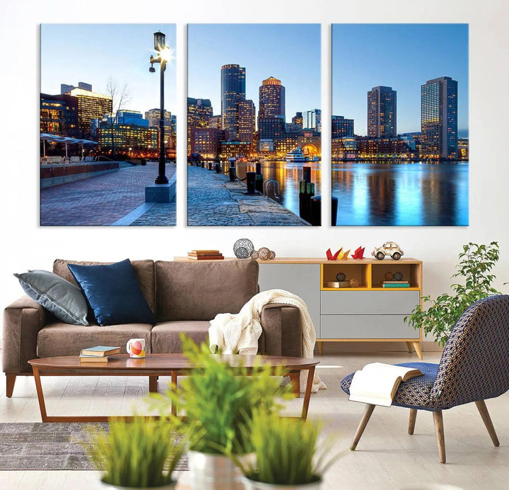 The modern living room features the Boston City Lights Sunrise Skyline Cityscape View Wall Art Canvas Print, crafted with museum-quality canvas and a UV-protective coating.