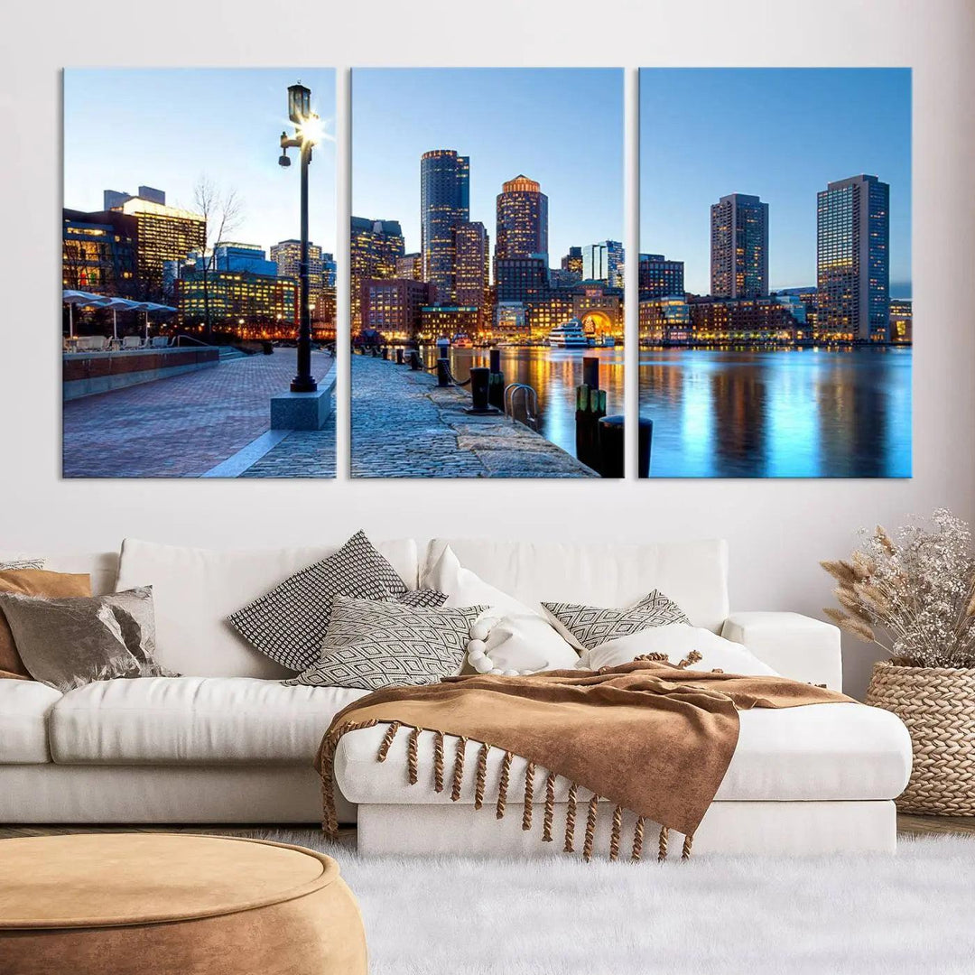 The modern living room features the Boston City Lights Sunrise Skyline Cityscape View Wall Art Canvas Print, crafted with museum-quality canvas and a UV-protective coating.