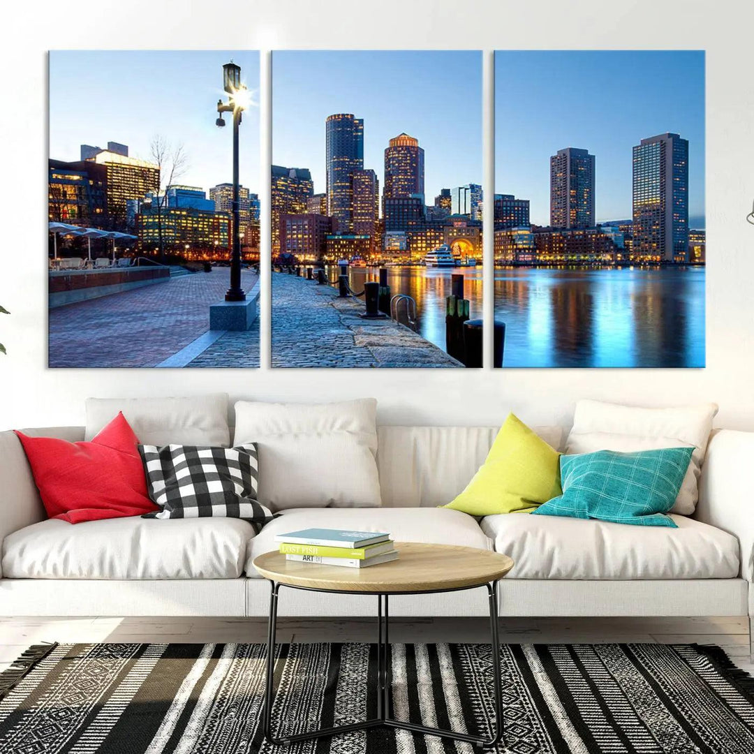 The modern living room features the Boston City Lights Sunrise Skyline Cityscape View Wall Art Canvas Print, crafted with museum-quality canvas and a UV-protective coating.