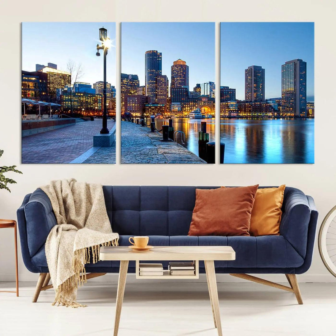 The modern living room features the Boston City Lights Sunrise Skyline Cityscape View Wall Art Canvas Print, crafted with museum-quality canvas and a UV-protective coating.