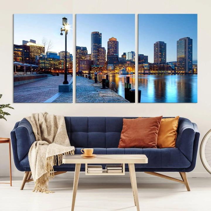 The modern living room features the Boston City Lights Sunrise Skyline Cityscape View Wall Art Canvas Print, crafted with museum-quality canvas and a UV-protective coating.