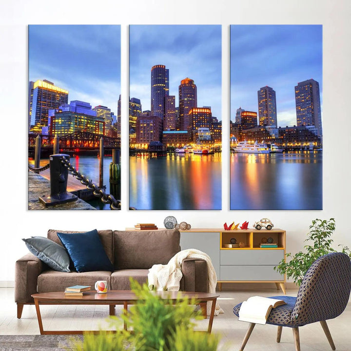 The Boston City Lights Sunset Cloudy Blue Skyline Cityscape View Wall Art Canvas Print embellishes a contemporary living room. This gallery-wrapped canvas set guarantees museum-quality canvases to enhance any space.