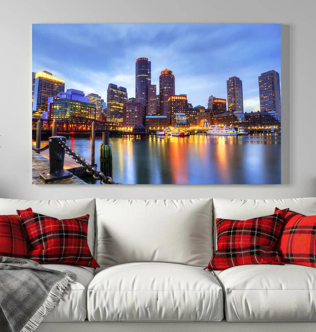 The Boston City Lights Sunset Cloudy Blue Skyline Cityscape View Wall Art Canvas Print embellishes a contemporary living room. This gallery-wrapped canvas set guarantees museum-quality canvases to enhance any space.