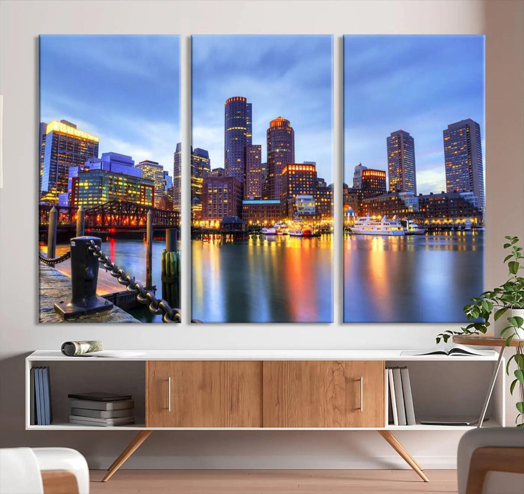 The Boston City Lights Sunset Cloudy Blue Skyline Cityscape View Wall Art Canvas Print embellishes a contemporary living room. This gallery-wrapped canvas set guarantees museum-quality canvases to enhance any space.