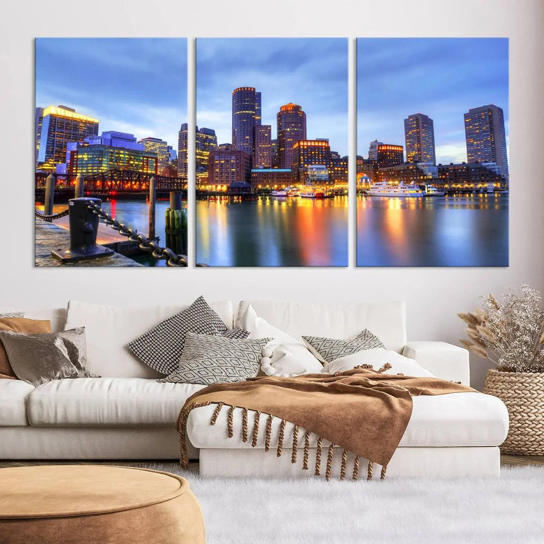 The Boston City Lights Sunset Cloudy Blue Skyline Cityscape View Wall Art Canvas Print embellishes a contemporary living room. This gallery-wrapped canvas set guarantees museum-quality canvases to enhance any space.