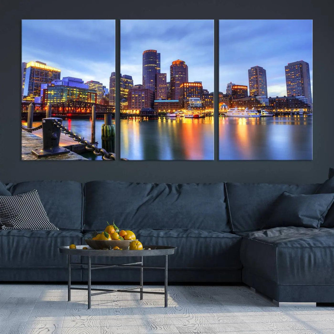 The Boston City Lights Sunset Cloudy Blue Skyline Cityscape View Wall Art Canvas Print embellishes a contemporary living room. This gallery-wrapped canvas set guarantees museum-quality canvases to enhance any space.