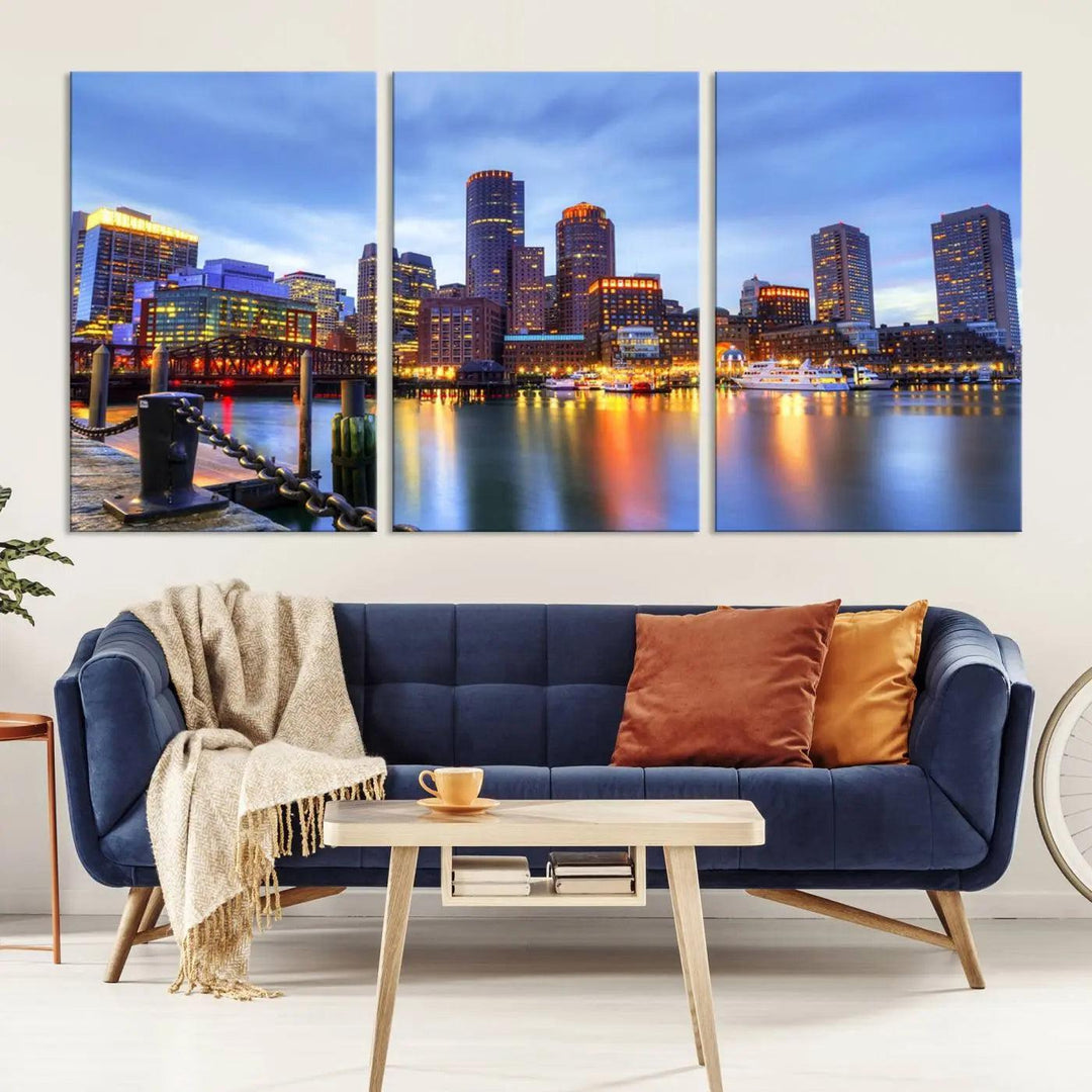 The Boston City Lights Sunset Cloudy Blue Skyline Cityscape View Wall Art Canvas Print embellishes a contemporary living room. This gallery-wrapped canvas set guarantees museum-quality canvases to enhance any space.