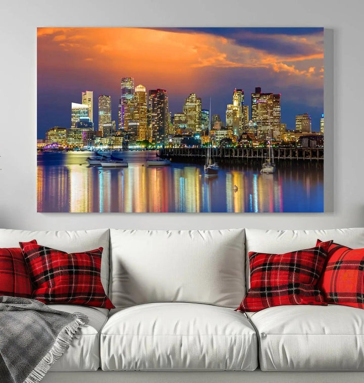 A contemporary dining area features a large triptych wall art of the Boston City Night skyline in blue and orange hues, printed on museum-quality canvases to ensure lasting beauty.