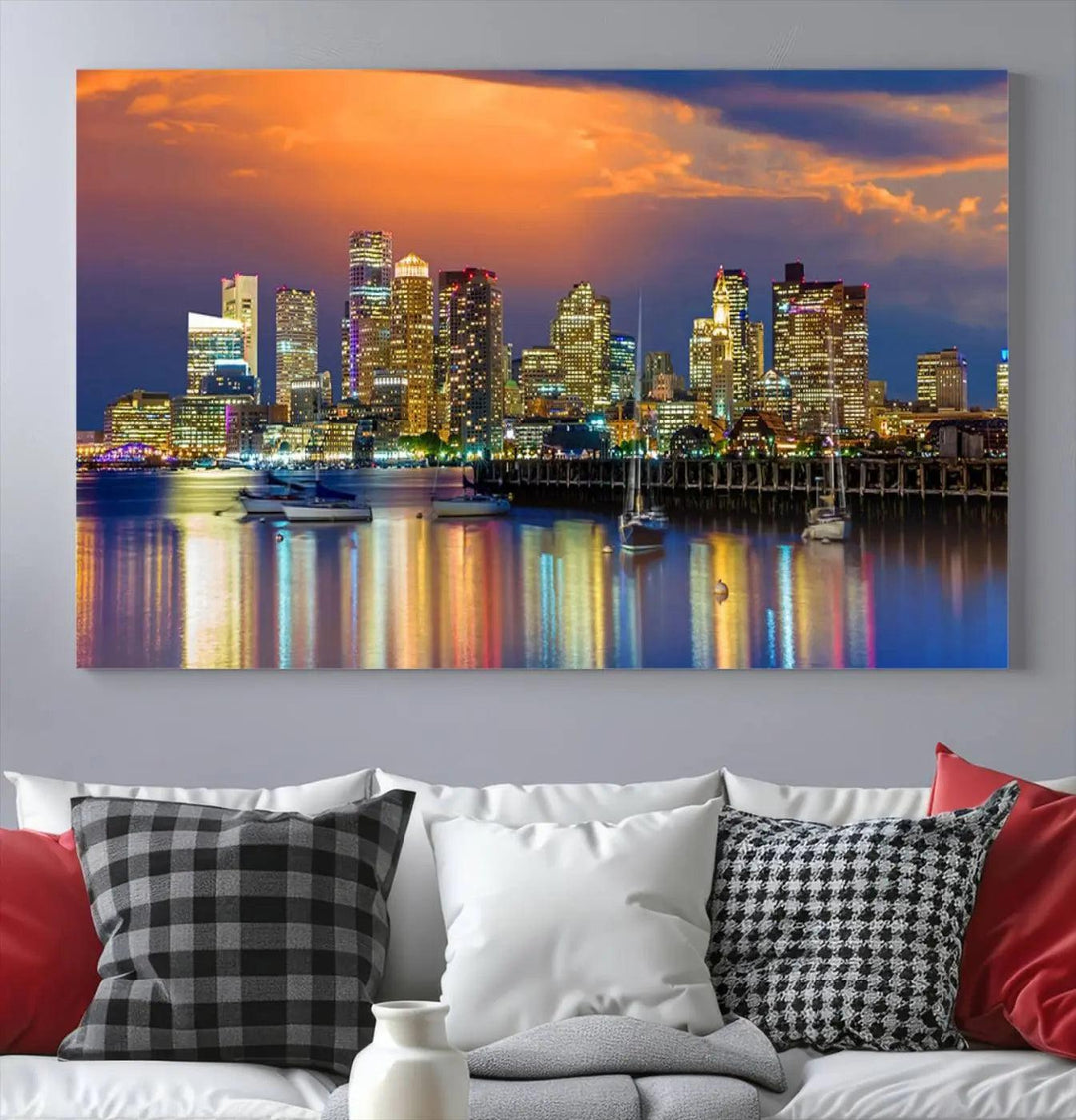 A contemporary dining area features a large triptych wall art of the Boston City Night skyline in blue and orange hues, printed on museum-quality canvases to ensure lasting beauty.