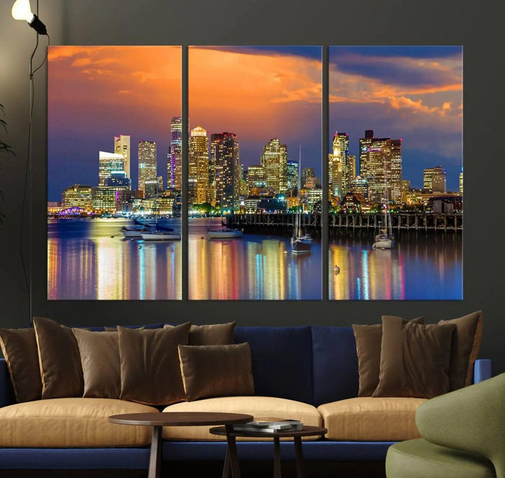 A contemporary dining area features a large triptych wall art of the Boston City Night skyline in blue and orange hues, printed on museum-quality canvases to ensure lasting beauty.