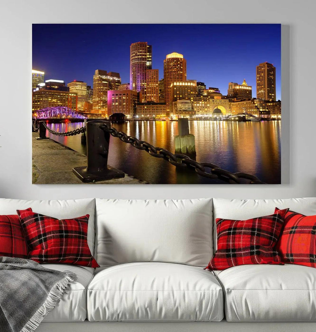 The "Boston City Night Skyline Cityscape View Wall Art Canvas Print" beautifully portrays a stunning triptych of a city skyline illuminated against the night sky, elegantly reflected in the river below. These museum-quality canvases are gallery wrapped to ensure an elegant presentation that enhances any space.