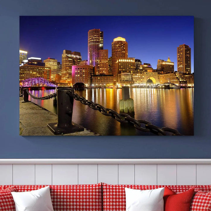 The "Boston City Night Skyline Cityscape View Wall Art Canvas Print" beautifully portrays a stunning triptych of a city skyline illuminated against the night sky, elegantly reflected in the river below. These museum-quality canvases are gallery wrapped to ensure an elegant presentation that enhances any space.