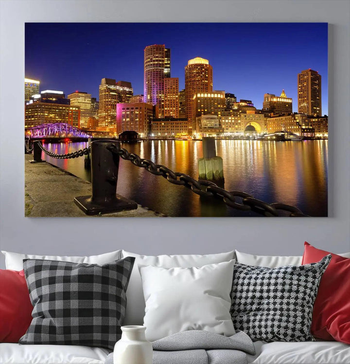 The "Boston City Night Skyline Cityscape View Wall Art Canvas Print" beautifully portrays a stunning triptych of a city skyline illuminated against the night sky, elegantly reflected in the river below. These museum-quality canvases are gallery wrapped to ensure an elegant presentation that enhances any space.