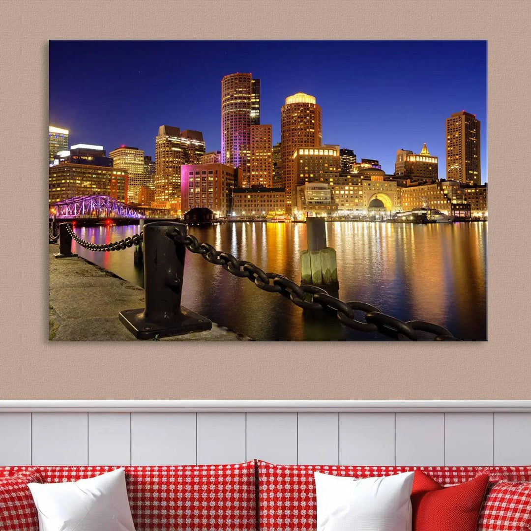 The "Boston City Night Skyline Cityscape View Wall Art Canvas Print" beautifully portrays a stunning triptych of a city skyline illuminated against the night sky, elegantly reflected in the river below. These museum-quality canvases are gallery wrapped to ensure an elegant presentation that enhances any space.