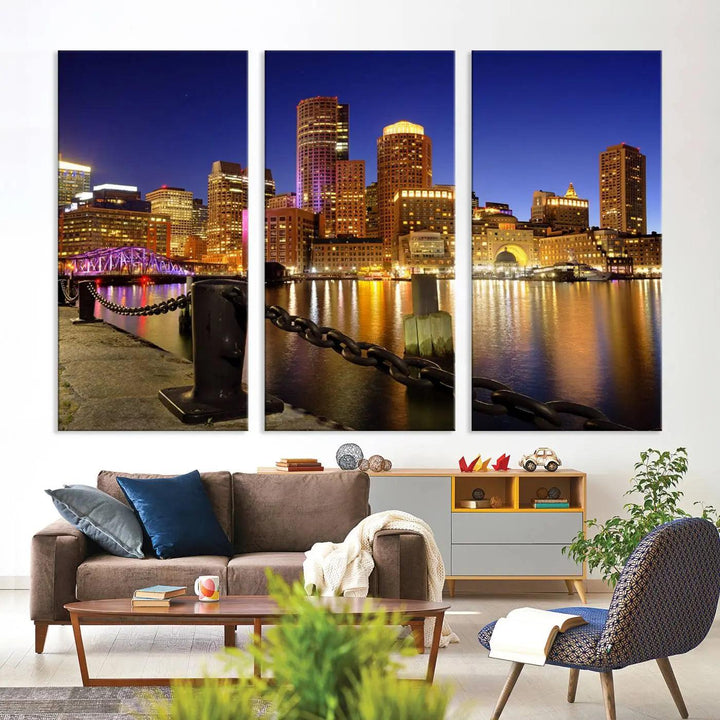 The "Boston City Night Skyline Cityscape View Wall Art Canvas Print" beautifully portrays a stunning triptych of a city skyline illuminated against the night sky, elegantly reflected in the river below. These museum-quality canvases are gallery wrapped to ensure an elegant presentation that enhances any space.