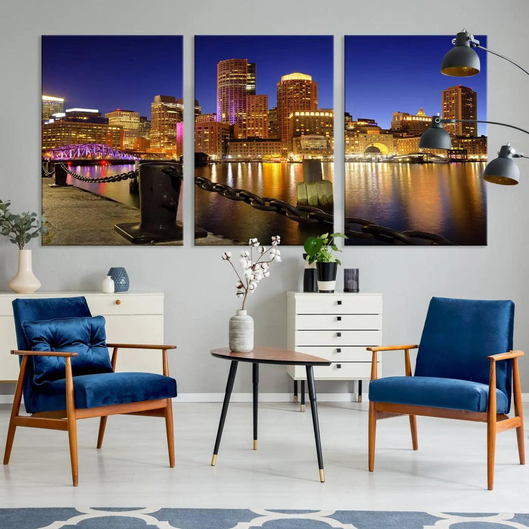 The "Boston City Night Skyline Cityscape View Wall Art Canvas Print" beautifully portrays a stunning triptych of a city skyline illuminated against the night sky, elegantly reflected in the river below. These museum-quality canvases are gallery wrapped to ensure an elegant presentation that enhances any space.