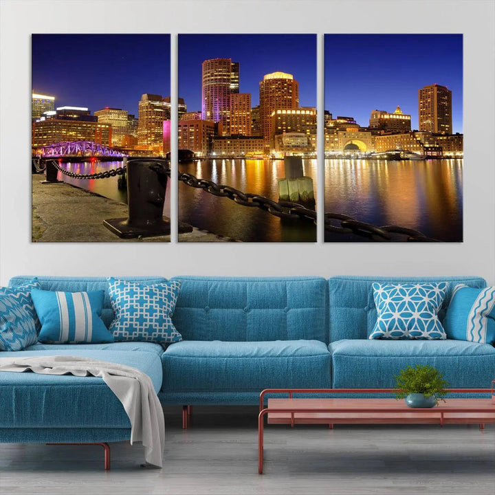 The "Boston City Night Skyline Cityscape View Wall Art Canvas Print" beautifully portrays a stunning triptych of a city skyline illuminated against the night sky, elegantly reflected in the river below. These museum-quality canvases are gallery wrapped to ensure an elegant presentation that enhances any space.