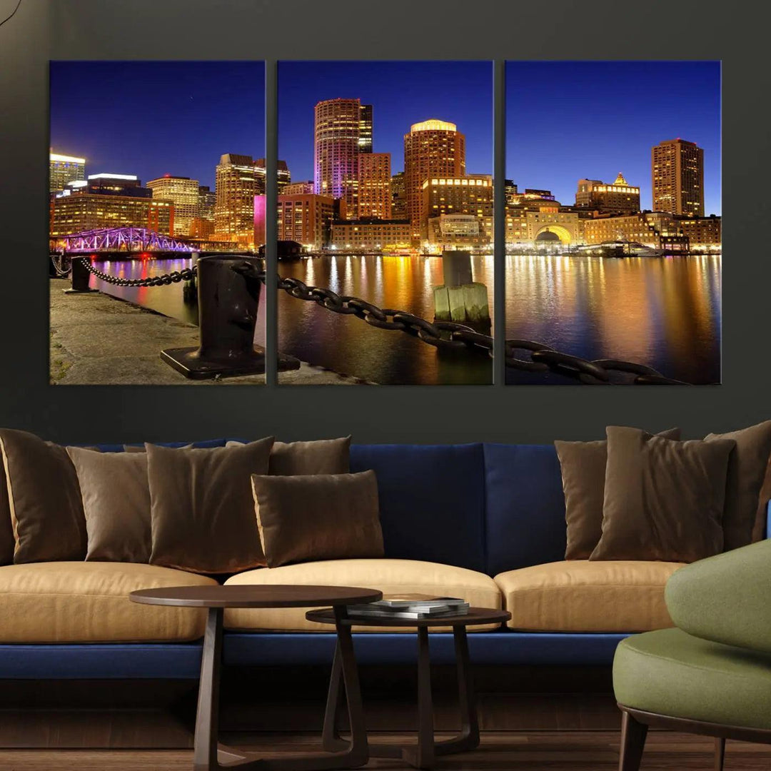 The "Boston City Night Skyline Cityscape View Wall Art Canvas Print" beautifully portrays a stunning triptych of a city skyline illuminated against the night sky, elegantly reflected in the river below. These museum-quality canvases are gallery wrapped to ensure an elegant presentation that enhances any space.