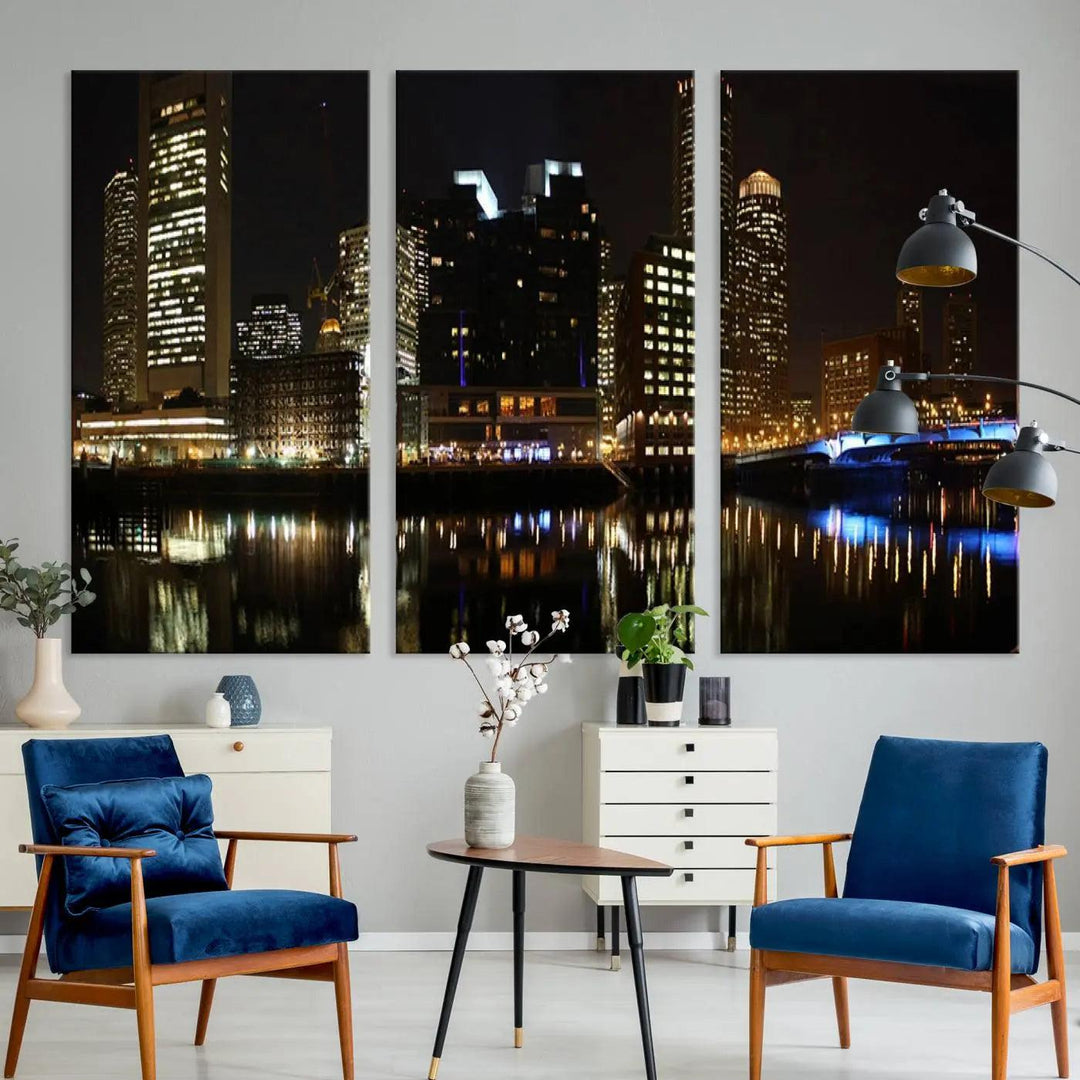 The Boston Night Skyline Cityscape View Wall Art Canvas Print depicts a triptych of the illuminated city reflected in water, enhancing a modern living room with its vibrant imagery. This gallery-wrapped masterpiece on museum-quality canvas brings an artistic flair to your space.