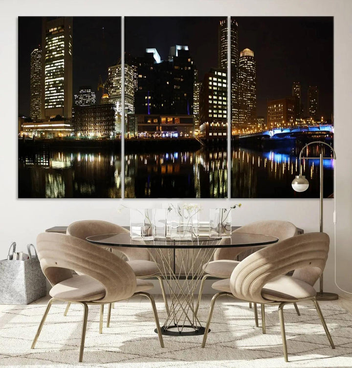 The Boston Night Skyline Cityscape View Wall Art Canvas Print depicts a triptych of the illuminated city reflected in water, enhancing a modern living room with its vibrant imagery. This gallery-wrapped masterpiece on museum-quality canvas brings an artistic flair to your space.