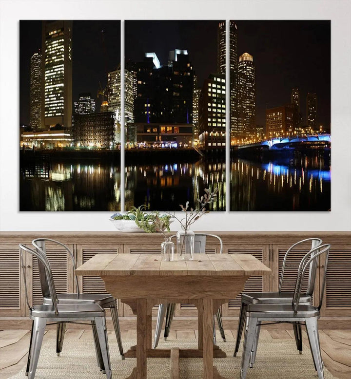 The Boston Night Skyline Cityscape View Wall Art Canvas Print depicts a triptych of the illuminated city reflected in water, enhancing a modern living room with its vibrant imagery. This gallery-wrapped masterpiece on museum-quality canvas brings an artistic flair to your space.