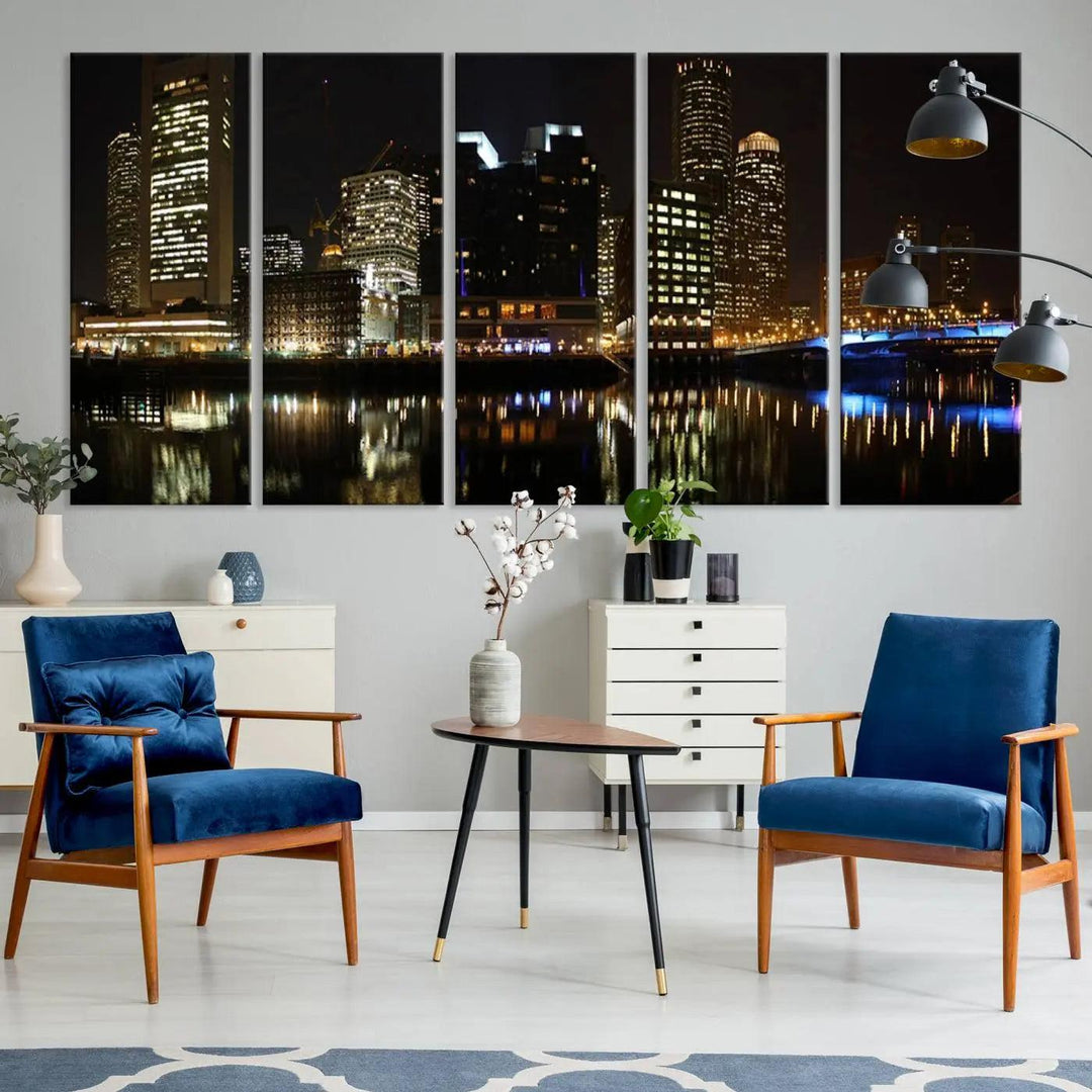 The Boston Night Skyline Cityscape View Wall Art Canvas Print depicts a triptych of the illuminated city reflected in water, enhancing a modern living room with its vibrant imagery. This gallery-wrapped masterpiece on museum-quality canvas brings an artistic flair to your space.