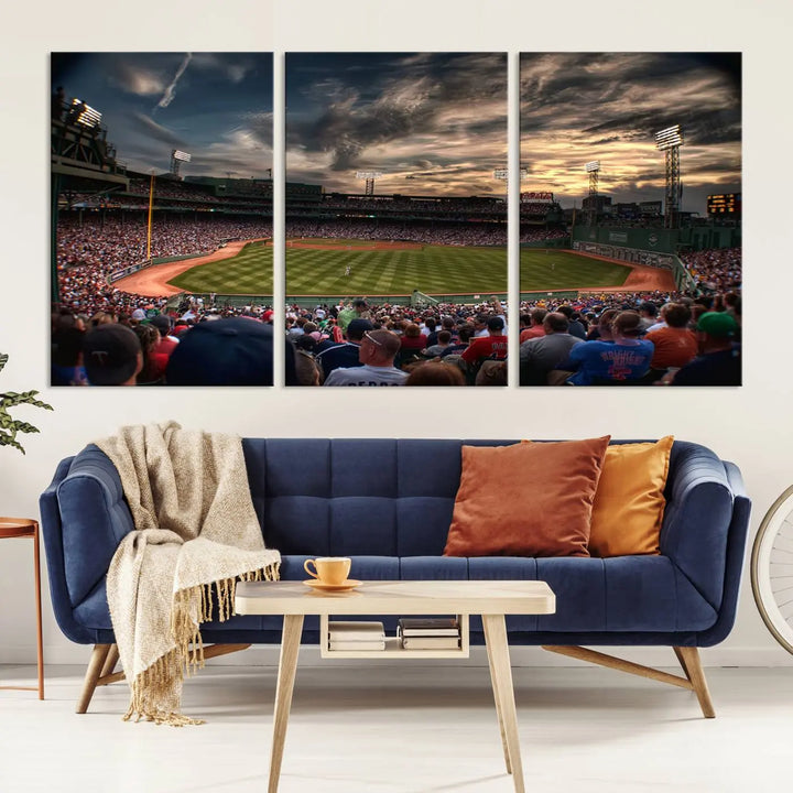 The Boston Red Sox Baseball Team Print, featuring Massachusetts's Fenway Park Stadium, brings charm and a gallery-quality finish to a cozy living room. It captures the essence of a crowded baseball stadium at sunset.