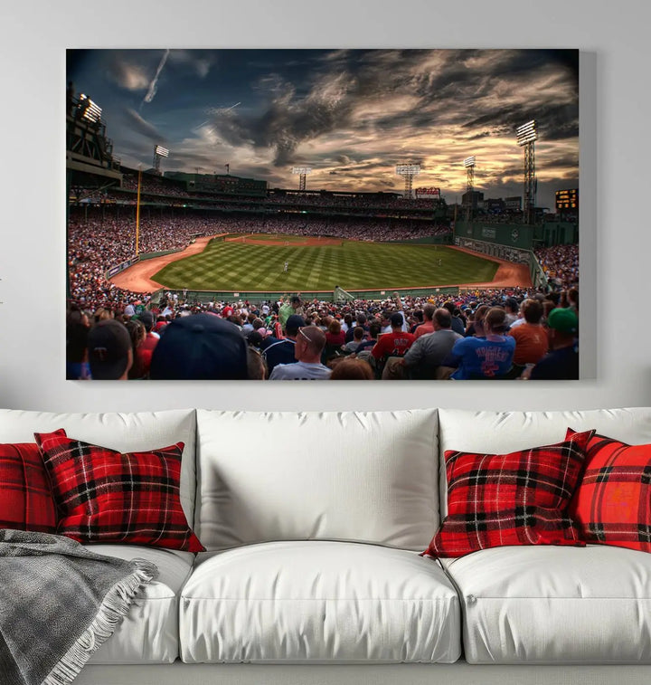 The Boston Red Sox Baseball Team Print, featuring Massachusetts's Fenway Park Stadium, brings charm and a gallery-quality finish to a cozy living room. It captures the essence of a crowded baseball stadium at sunset.