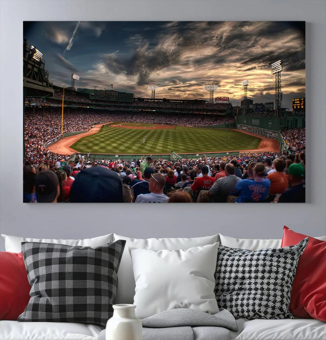 The Boston Red Sox Baseball Team Print, featuring Massachusetts's Fenway Park Stadium, brings charm and a gallery-quality finish to a cozy living room. It captures the essence of a crowded baseball stadium at sunset.