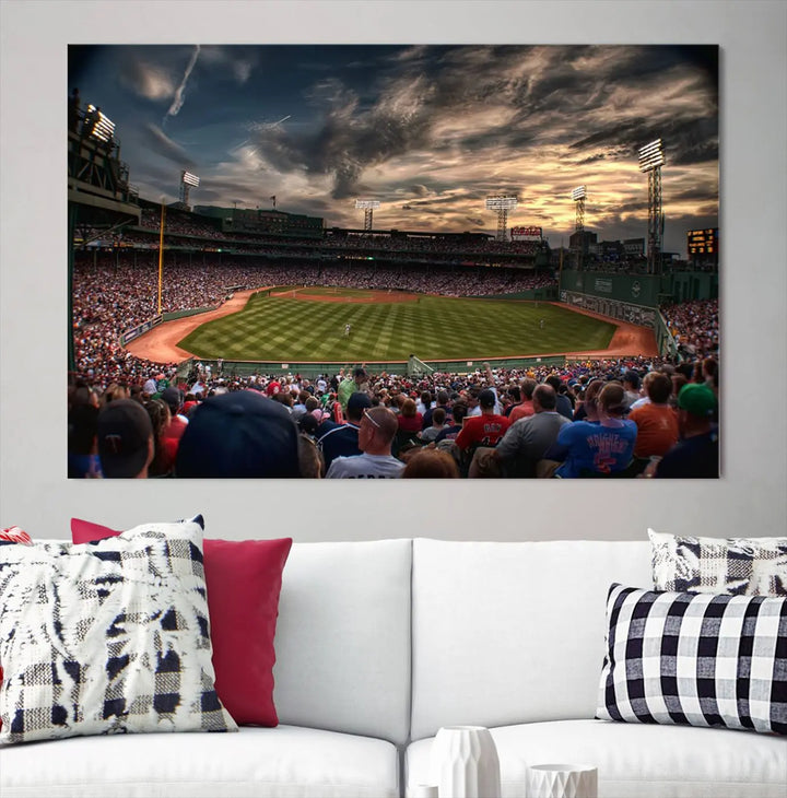 The Boston Red Sox Baseball Team Print, featuring Massachusetts's Fenway Park Stadium, brings charm and a gallery-quality finish to a cozy living room. It captures the essence of a crowded baseball stadium at sunset.