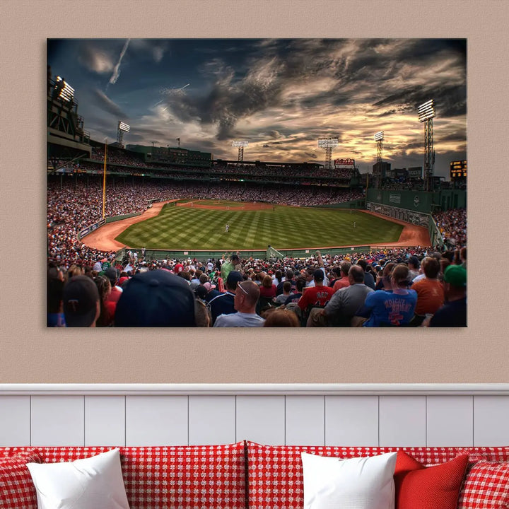 The Boston Red Sox Baseball Team Print, featuring Massachusetts's Fenway Park Stadium, brings charm and a gallery-quality finish to a cozy living room. It captures the essence of a crowded baseball stadium at sunset.