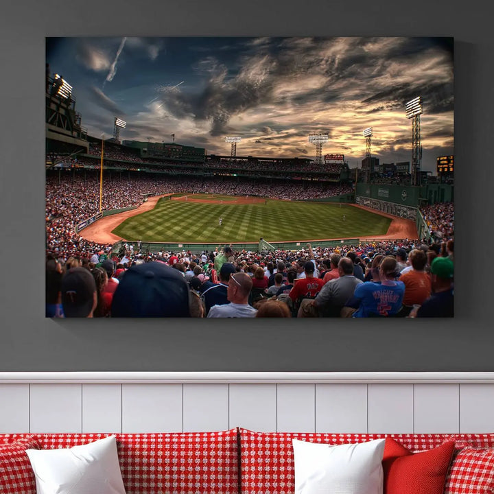 The Boston Red Sox Baseball Team Print, featuring Massachusetts's Fenway Park Stadium, brings charm and a gallery-quality finish to a cozy living room. It captures the essence of a crowded baseball stadium at sunset.