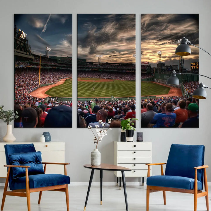 The Boston Red Sox Baseball Team Print, featuring Massachusetts's Fenway Park Stadium, brings charm and a gallery-quality finish to a cozy living room. It captures the essence of a crowded baseball stadium at sunset.