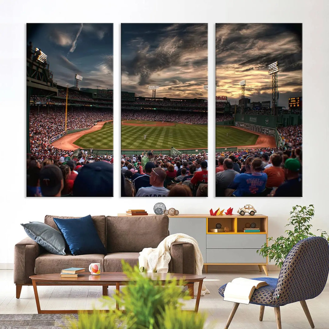 The Boston Red Sox Baseball Team Print, featuring Massachusetts's Fenway Park Stadium, brings charm and a gallery-quality finish to a cozy living room. It captures the essence of a crowded baseball stadium at sunset.