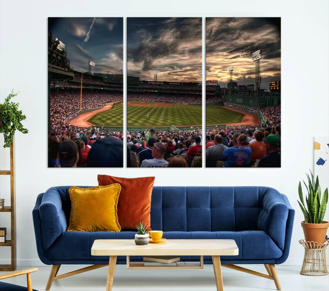 The Boston Red Sox Baseball Team Print, featuring Massachusetts's Fenway Park Stadium, brings charm and a gallery-quality finish to a cozy living room. It captures the essence of a crowded baseball stadium at sunset.