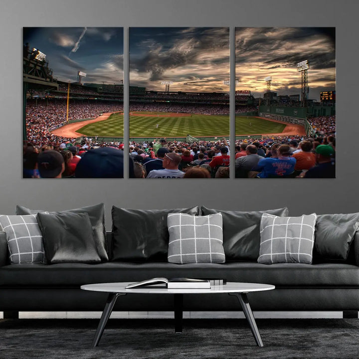 The Boston Red Sox Baseball Team Print, featuring Massachusetts's Fenway Park Stadium, brings charm and a gallery-quality finish to a cozy living room. It captures the essence of a crowded baseball stadium at sunset.