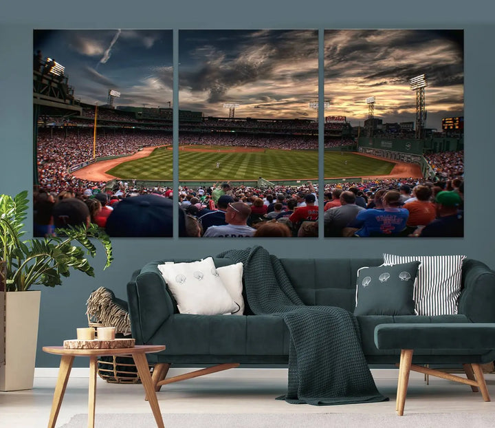 The Boston Red Sox Baseball Team Print, featuring Massachusetts's Fenway Park Stadium, brings charm and a gallery-quality finish to a cozy living room. It captures the essence of a crowded baseball stadium at sunset.