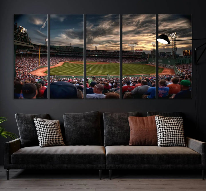 The Boston Red Sox Baseball Team Print, featuring Massachusetts's Fenway Park Stadium, brings charm and a gallery-quality finish to a cozy living room. It captures the essence of a crowded baseball stadium at sunset.