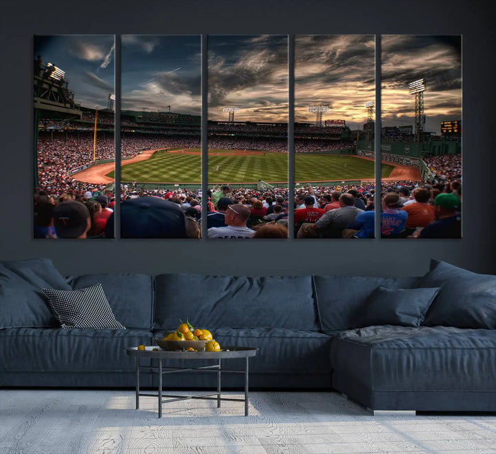 The Boston Red Sox Baseball Team Print, featuring Massachusetts's Fenway Park Stadium, brings charm and a gallery-quality finish to a cozy living room. It captures the essence of a crowded baseball stadium at sunset.