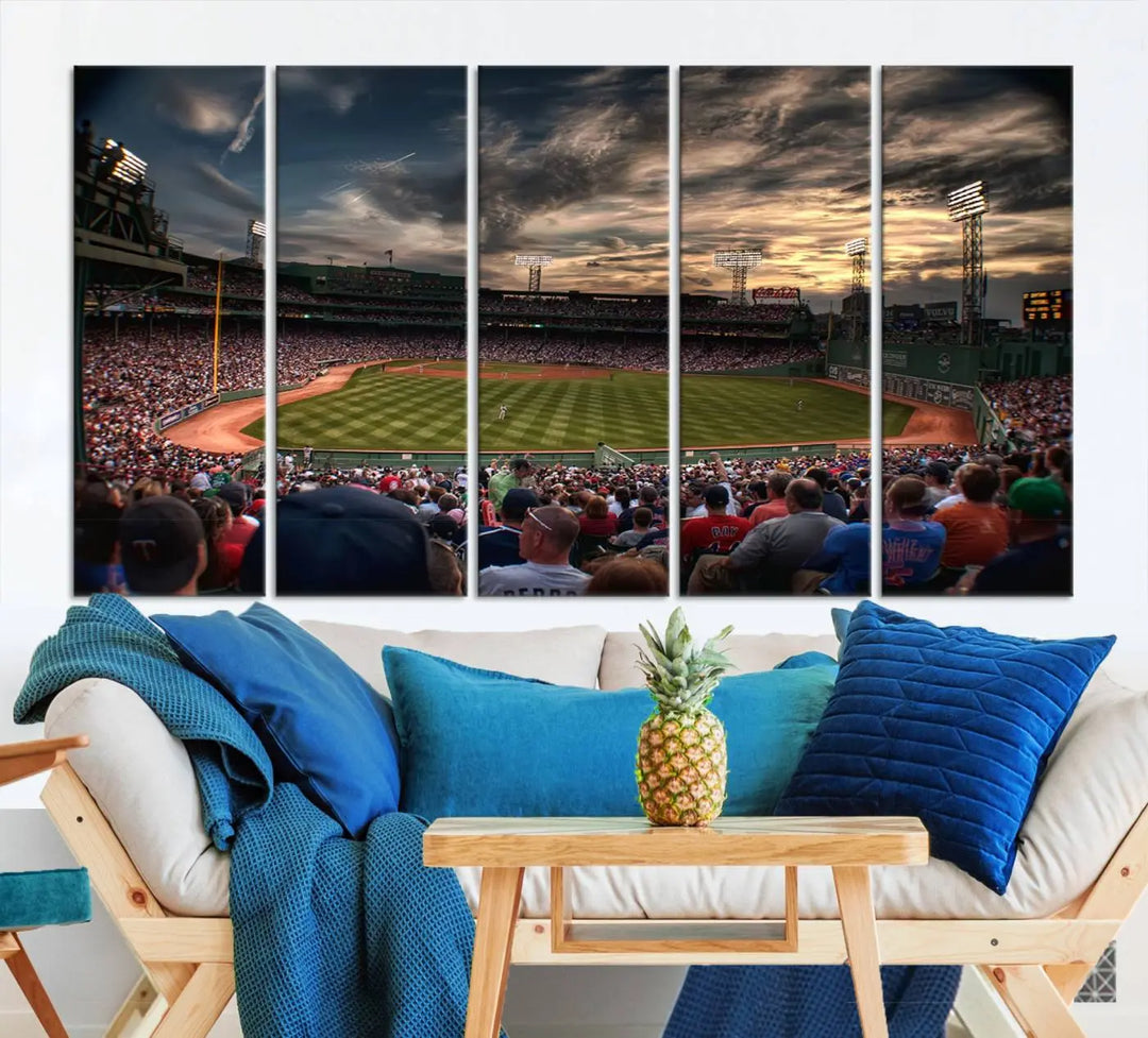 The Boston Red Sox Baseball Team Print, featuring Massachusetts's Fenway Park Stadium, brings charm and a gallery-quality finish to a cozy living room. It captures the essence of a crowded baseball stadium at sunset.