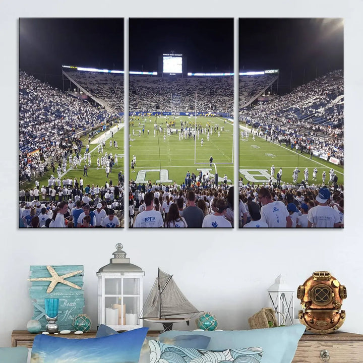 The living room is enhanced by a stunning triptych featuring the Brigham Young University Cougars Football Team Print. This premium canvas captures the vibrant atmosphere of Provo's LaVell Edwards Stadium at night, vividly portraying spectators and players on a well-lit field to bring an electrifying ambiance into your home.