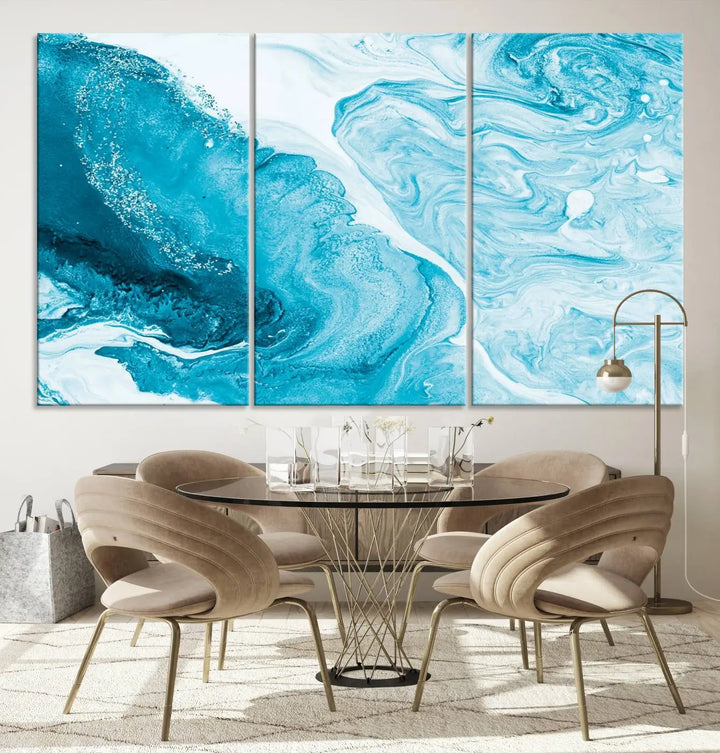 A modern living room showcasing the Bright Blue Marble Fluid Effect Wall Art Abstract Canvas, complete with a gallery-wrapped finish.