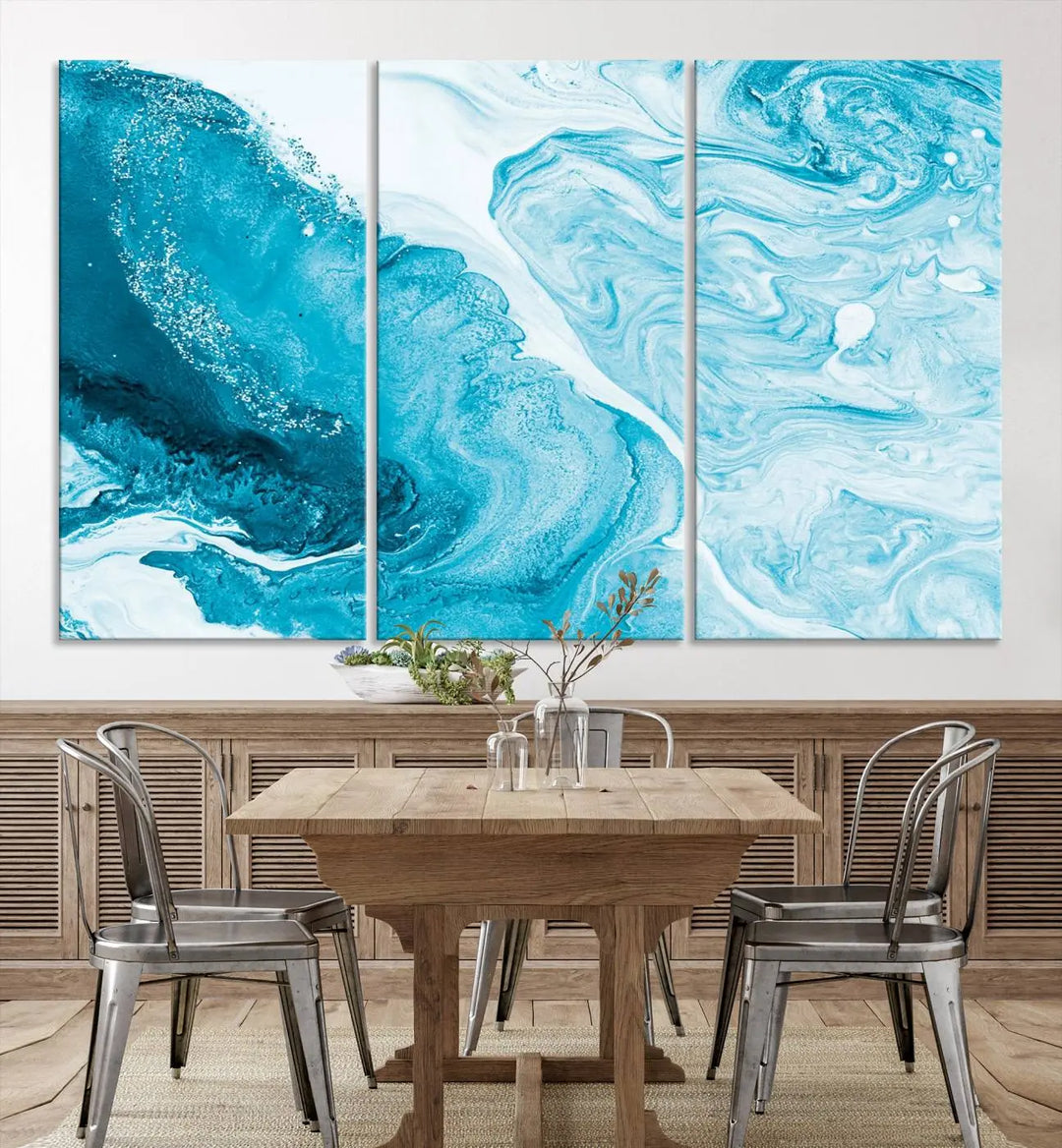 A modern living room showcasing the Bright Blue Marble Fluid Effect Wall Art Abstract Canvas, complete with a gallery-wrapped finish.