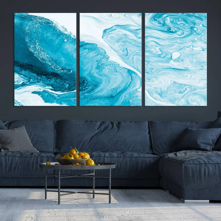 A modern living room showcasing the Bright Blue Marble Fluid Effect Wall Art Abstract Canvas, complete with a gallery-wrapped finish.