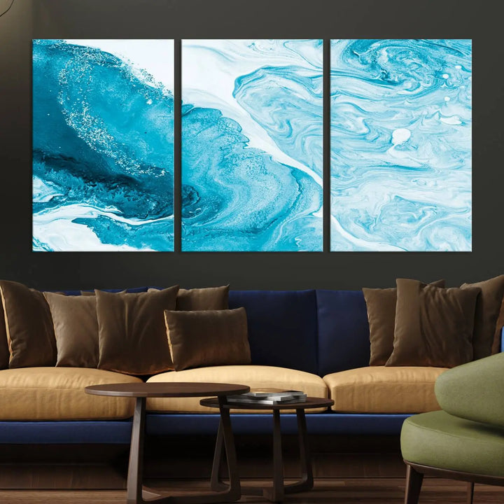 A modern living room showcasing the Bright Blue Marble Fluid Effect Wall Art Abstract Canvas, complete with a gallery-wrapped finish.