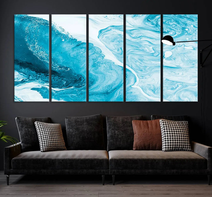 A modern living room showcasing the Bright Blue Marble Fluid Effect Wall Art Abstract Canvas, complete with a gallery-wrapped finish.