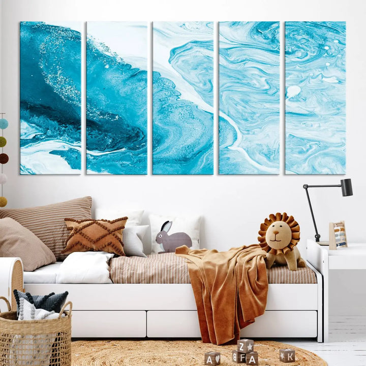 A modern living room showcasing the Bright Blue Marble Fluid Effect Wall Art Abstract Canvas, complete with a gallery-wrapped finish.