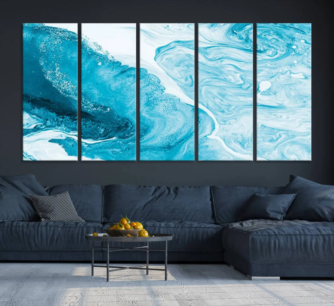 A modern living room showcasing the Bright Blue Marble Fluid Effect Wall Art Abstract Canvas, complete with a gallery-wrapped finish.