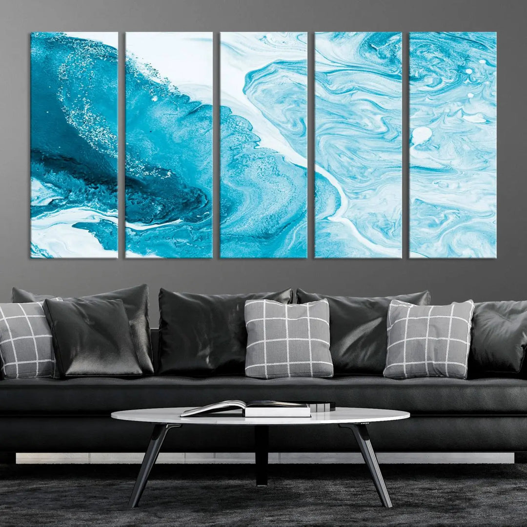 A modern living room showcasing the Bright Blue Marble Fluid Effect Wall Art Abstract Canvas, complete with a gallery-wrapped finish.